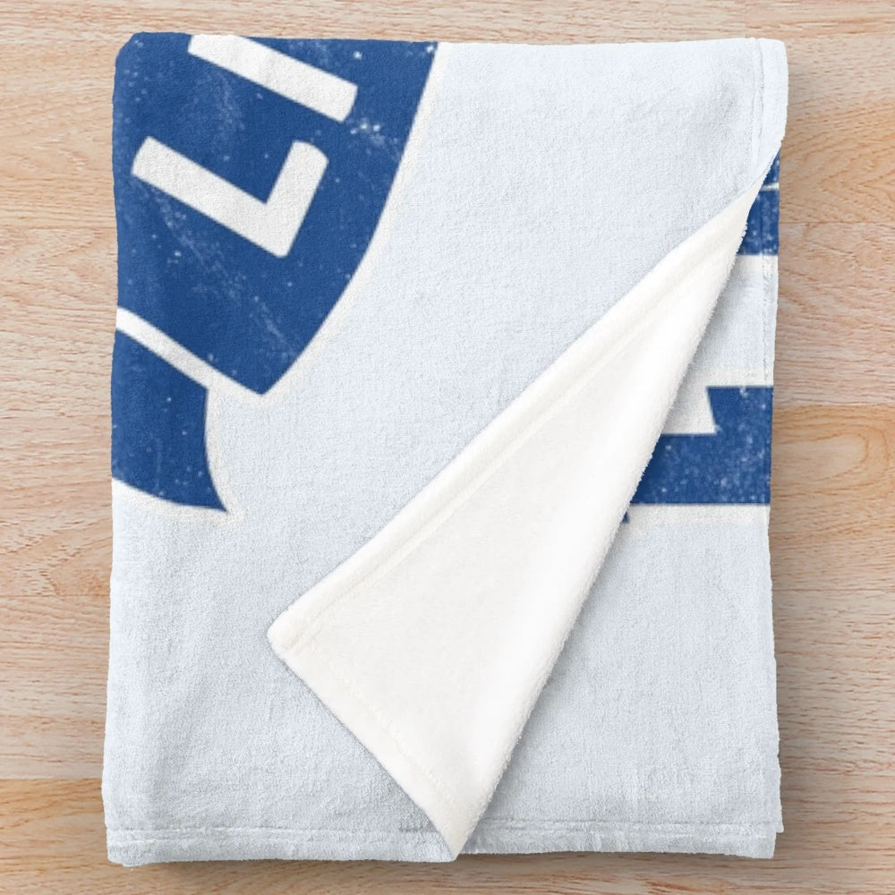 Plush blanket with the England Lionesses football shield design