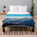 A plush blanket with the iconic Hollywood sign against a scenic Los Angeles landscape