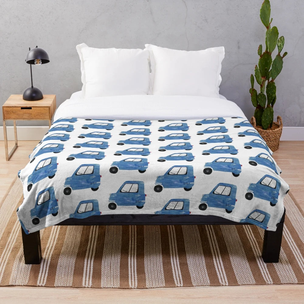 Plush blanket with the Peel P50 microcar design