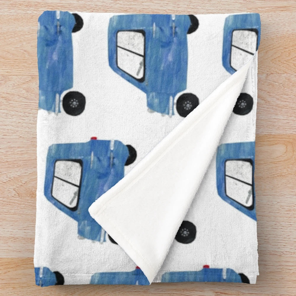Plush blanket with the Peel P50 microcar design