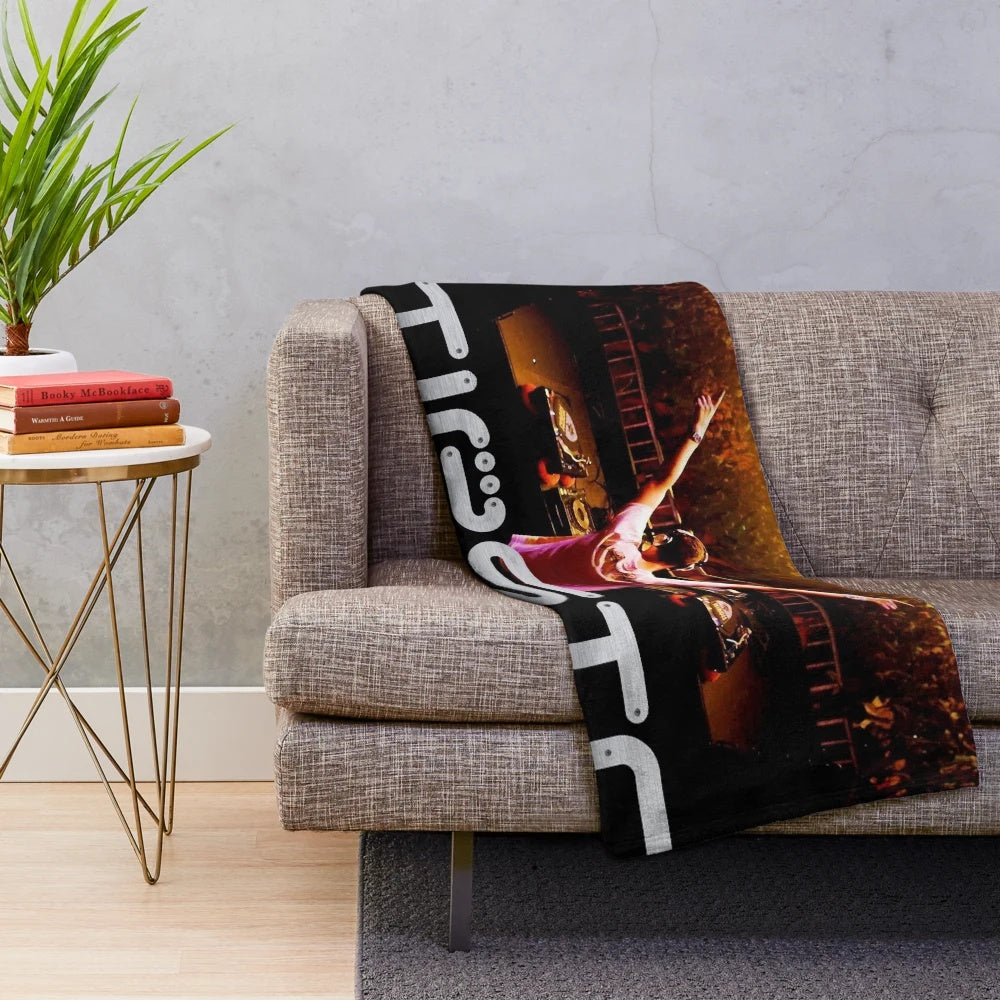 Plush blanket with Tiesto's image and branding