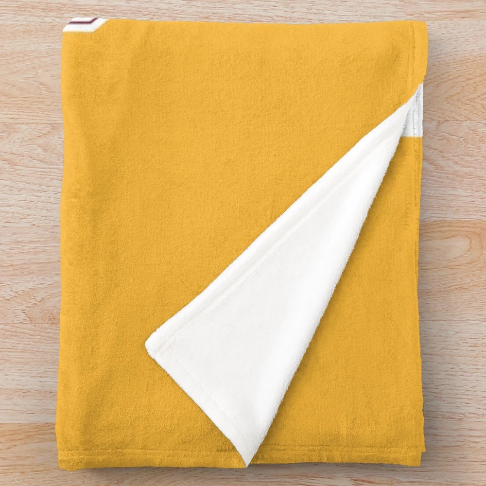 Plush blanket with University of Minnesota marching band uniform chevron design
