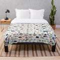 Colorful plush blanket with a variety of marine animals including fish, sharks, and whales