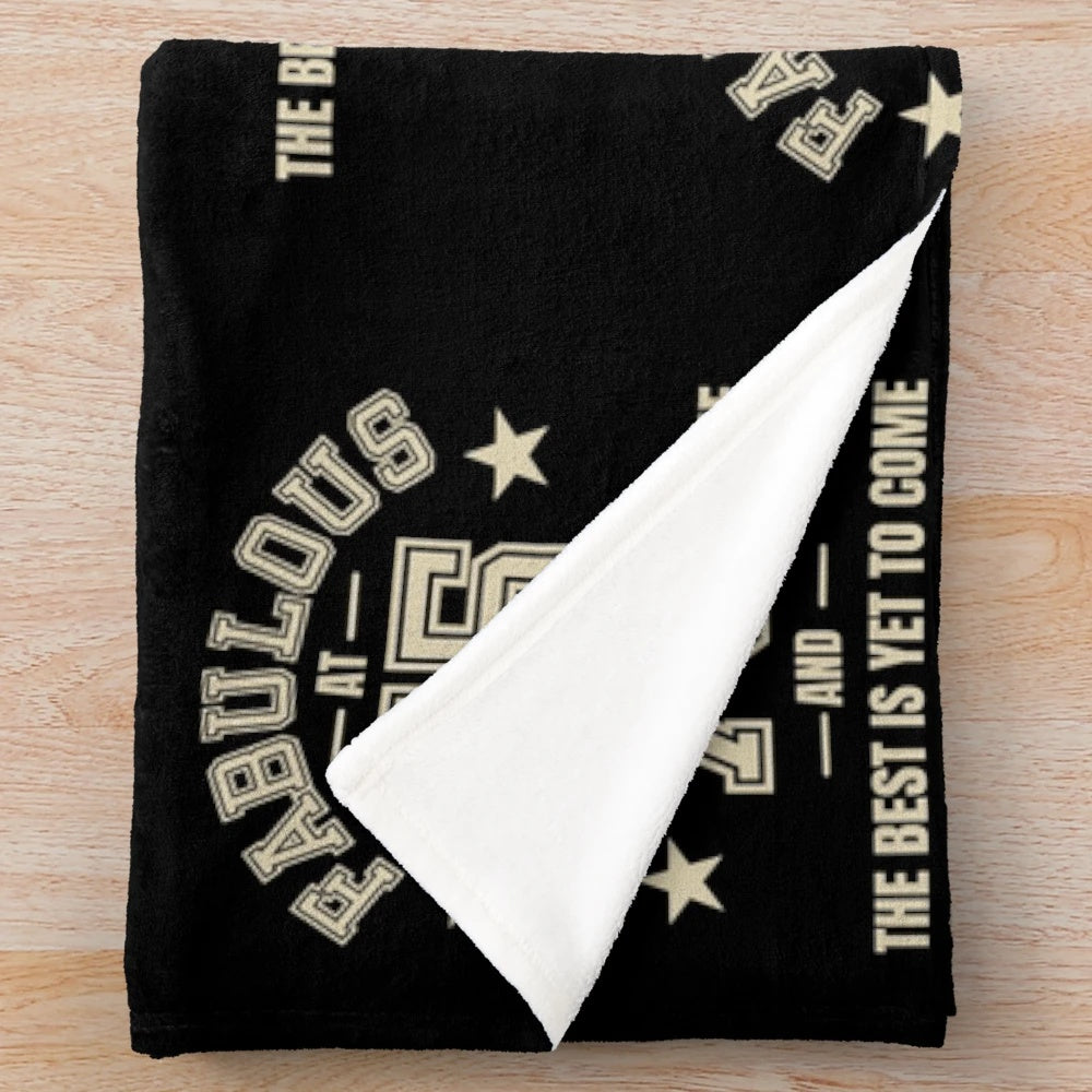 Plush blanket with "Fabulous at 75" and "The Best is Yet to Come" design for 75th birthday