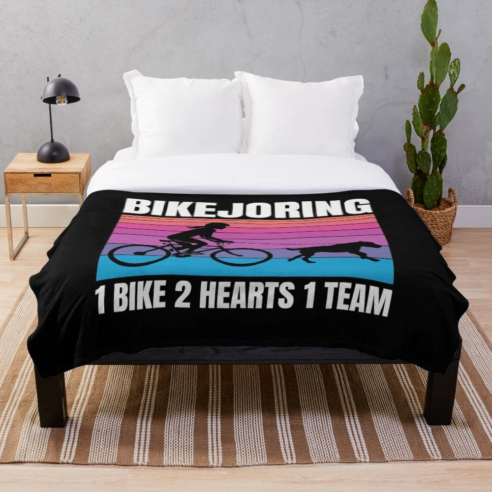 Plush blanket with bikejoring silhouette design