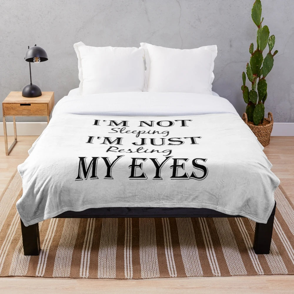 Plush blanket with the text "I'm Not Sleeping, I'm Just Resting My Eyes