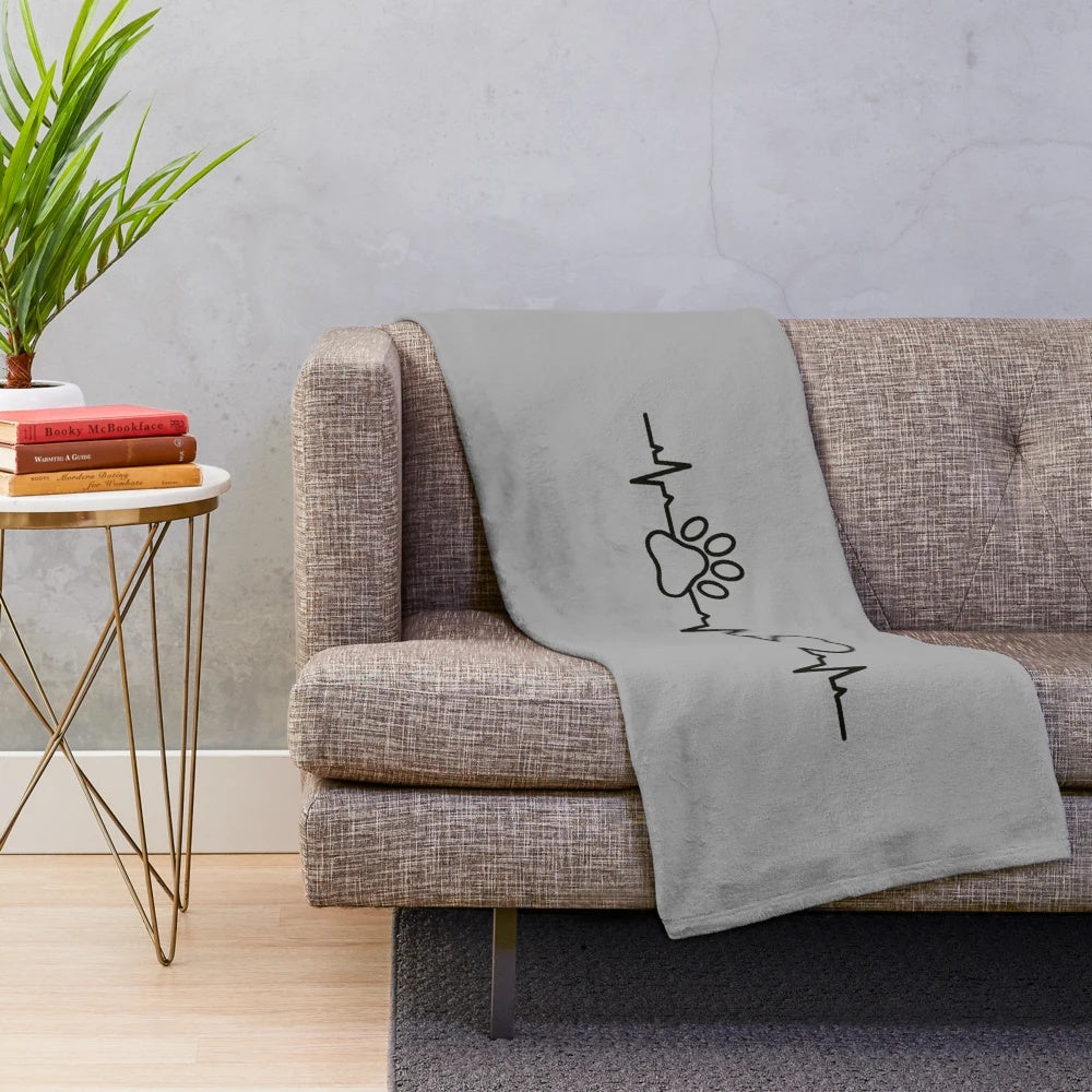 Plush blanket with heartbeat design for dog lovers in the veterinary medical field
