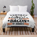 Soft plush blanket with a retro "Fantasy Football is the Bacon of Hobbies" design, great for football fans and collectors.
