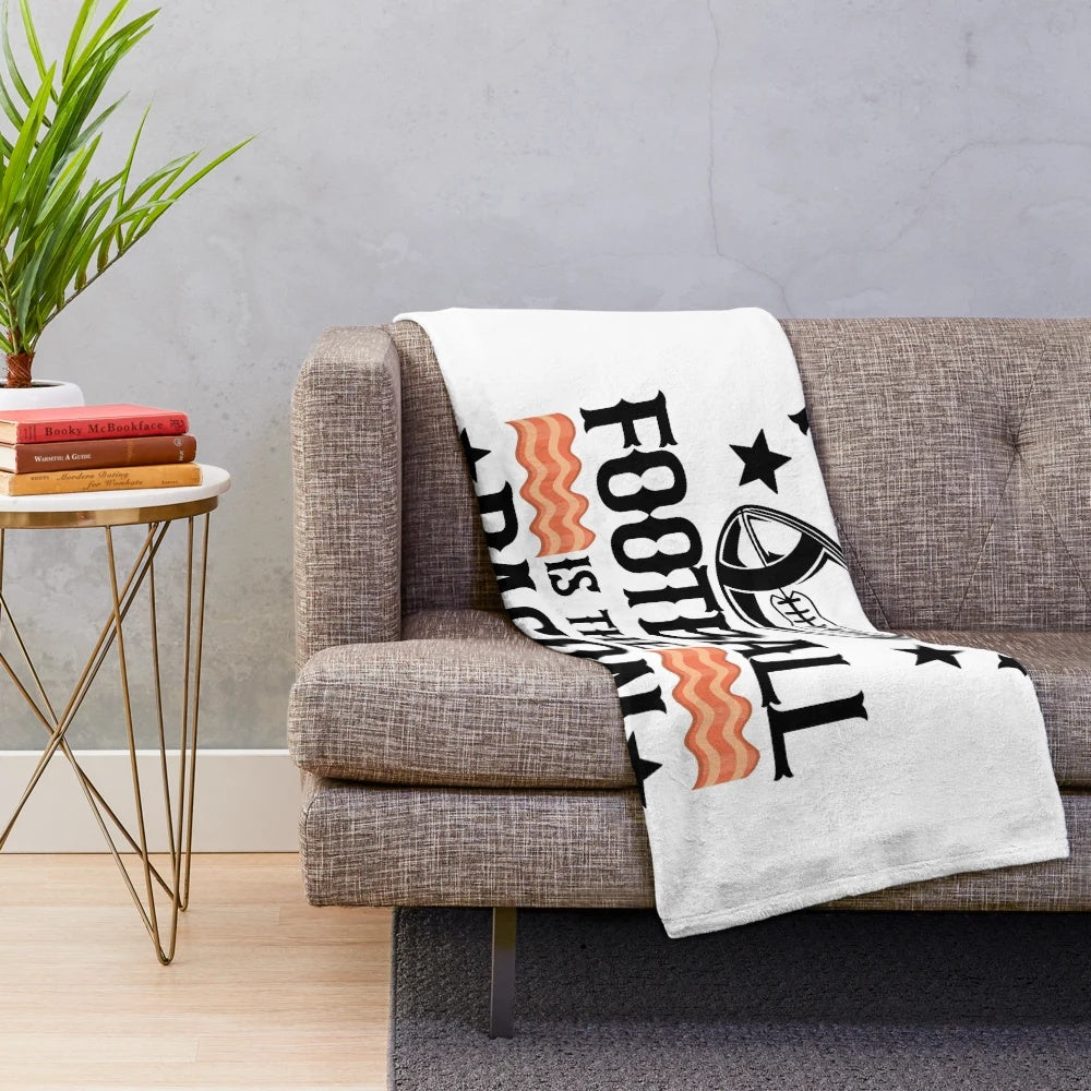 Soft plush blanket with a retro "Fantasy Football is the Bacon of Hobbies" design, great for football fans and collectors.
