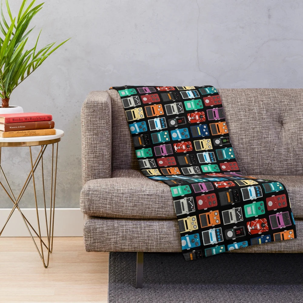 Plush blanket with guitar pedal design