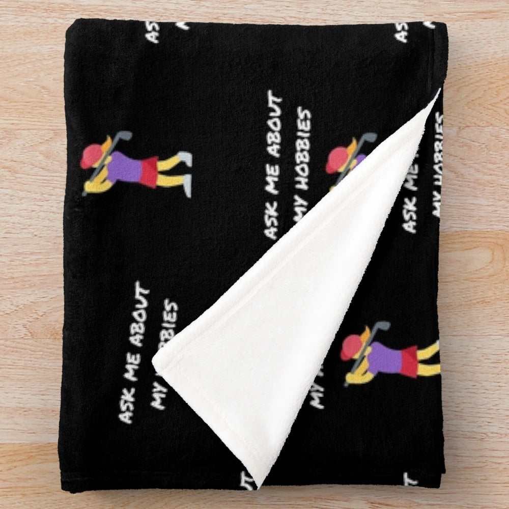 Plush blanket with "Ask me about my hobbies" design