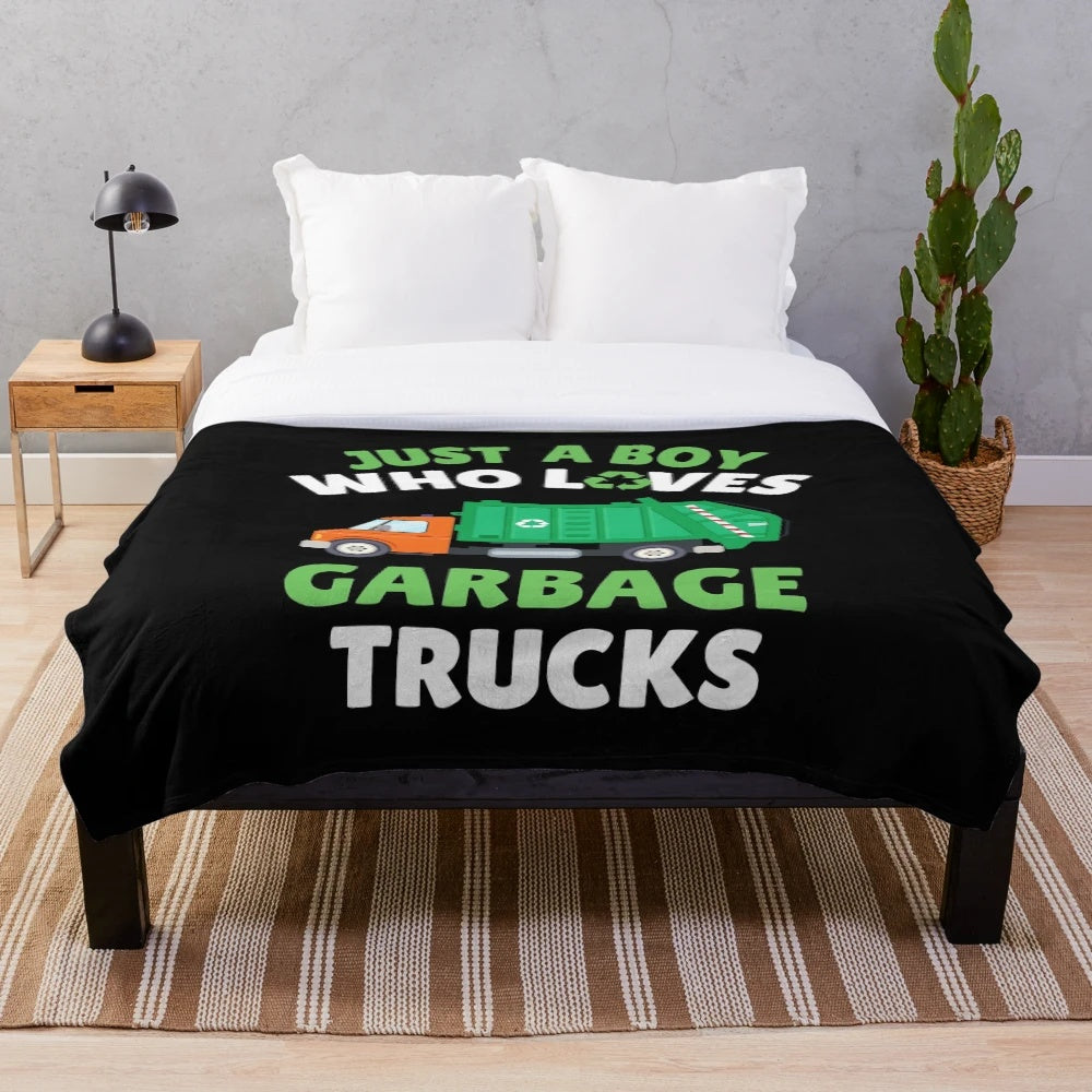 Plush blanket with a design of a young boy who loves garbage trucks