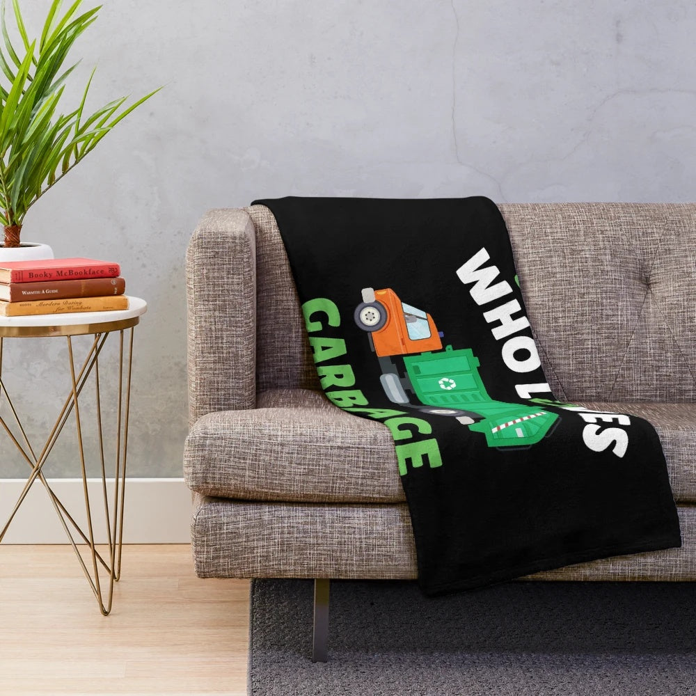 Plush blanket with a design of a young boy who loves garbage trucks