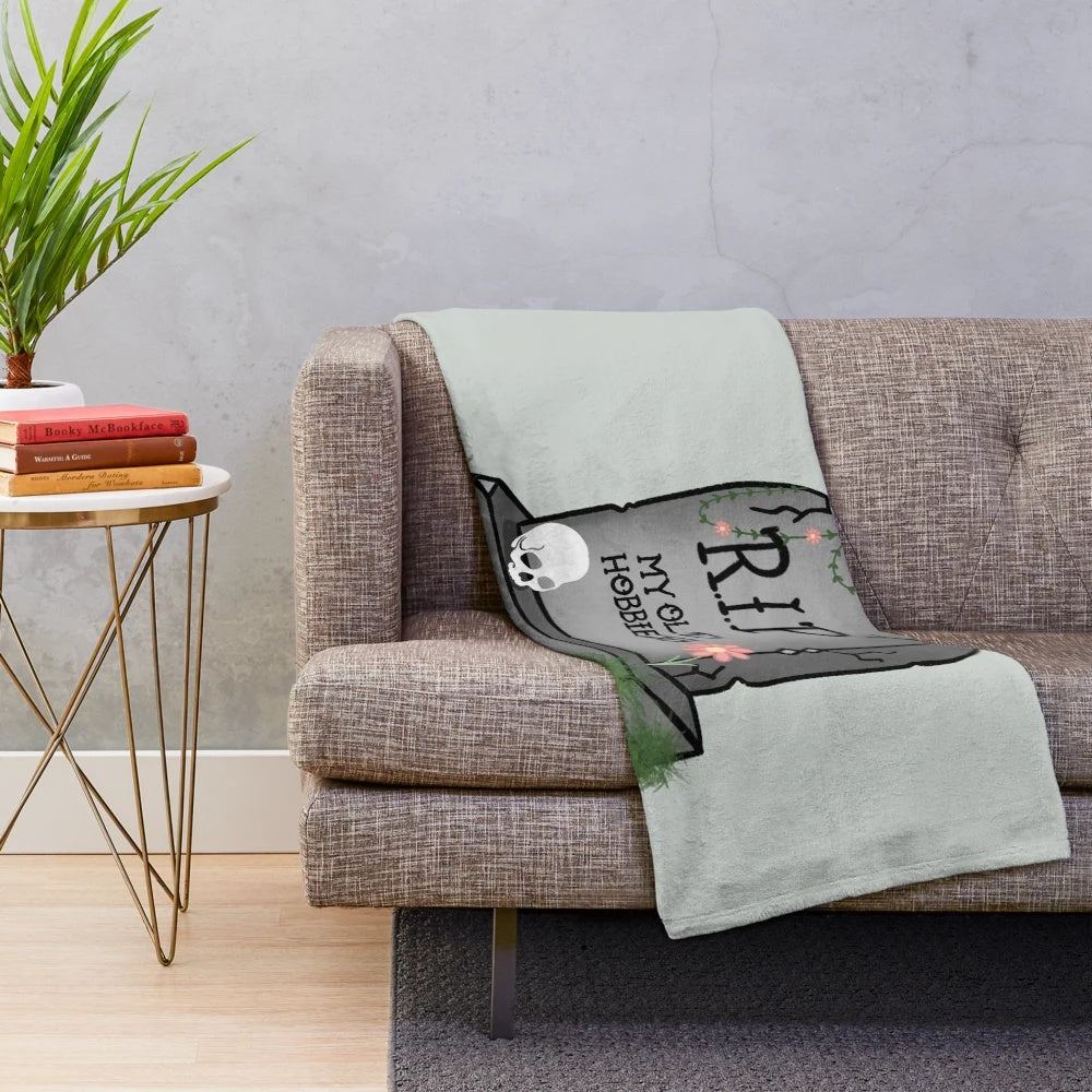 Plush blanket with skull and text "RIP: My Old Hobbies
