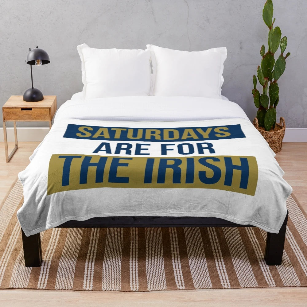Plush blanket with "Saturdays Are For The Irish" design, featuring Notre Dame Fighting Irish graphics