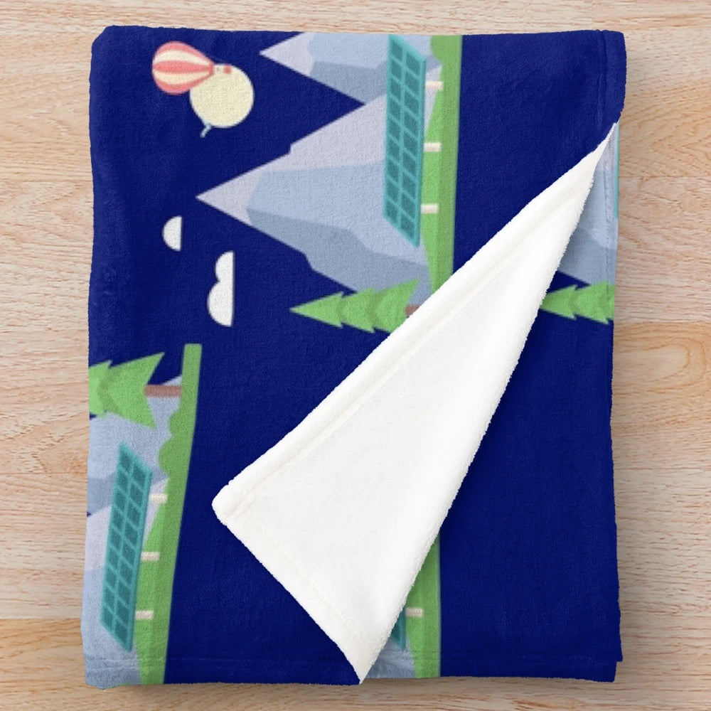 Plush mountain and paragliding themed blanket