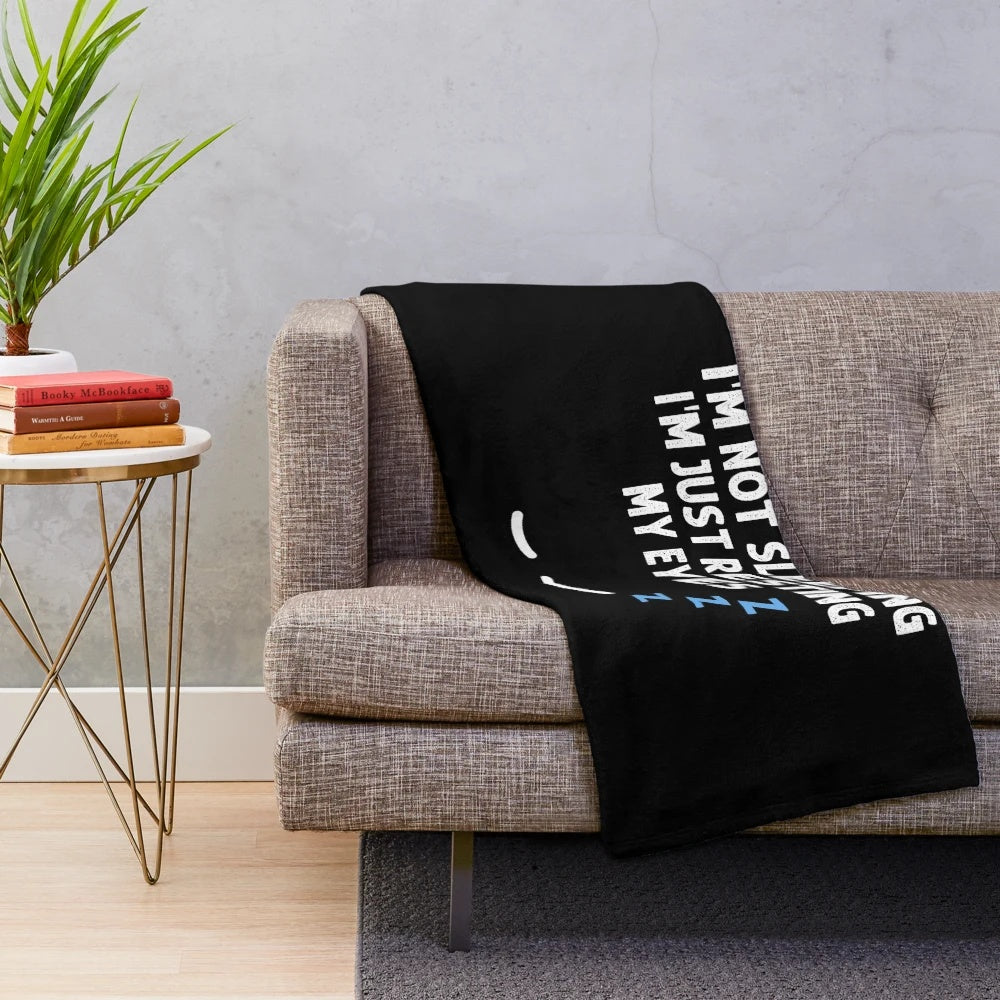 Plush blanket with "I'm not sleeping, I'm just resting my eyes" design