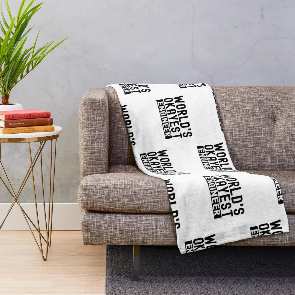 Plush blanket with the text 'World's Okayest Engineer