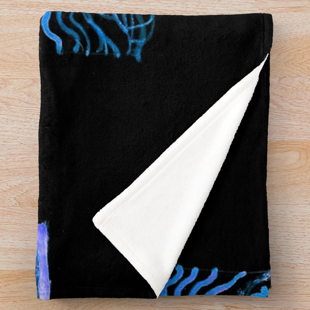 Plush blanket with underwater-inspired design for cozy relaxation