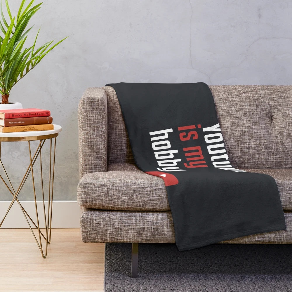 A cozy plush blanket featuring the words "Youtube Is My Hobby