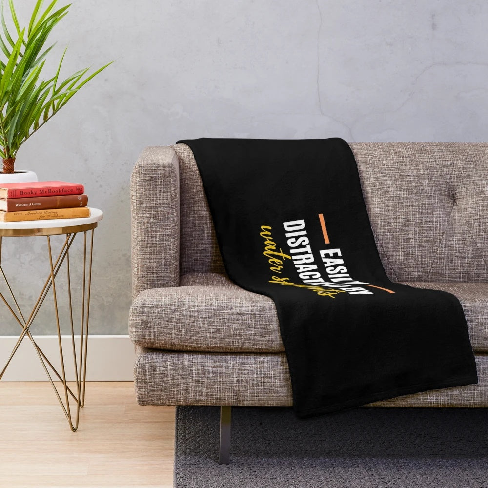 Plush blanket with "Easily Distracted By Water Sports" text