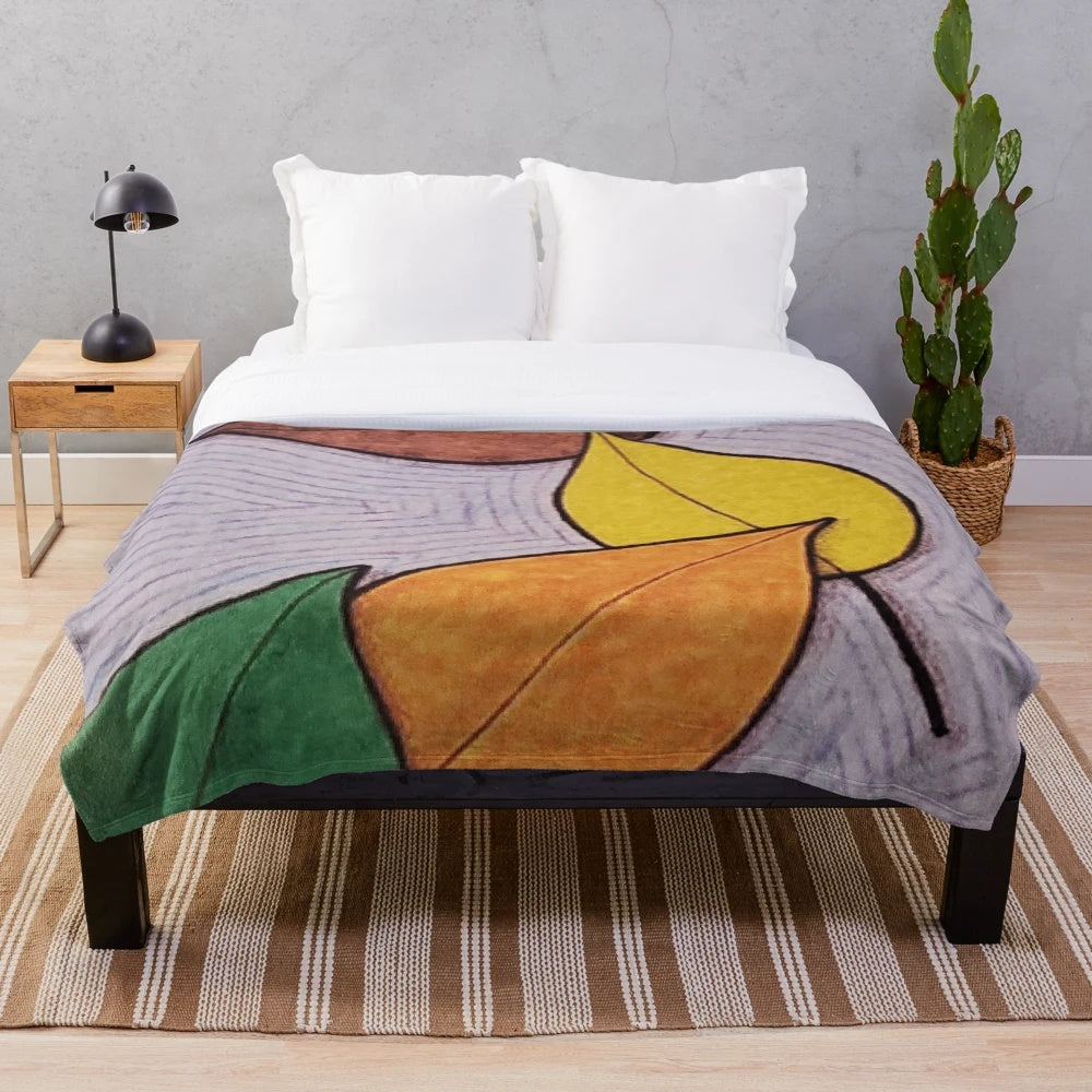 Plush blanket with a design of fall and winter scenes, honoring the memory of Pat J.