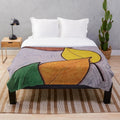Plush blanket with a design of fall and winter scenes, honoring the memory of Pat J.