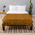 Darjeeling Limited themed plush blanket with safari animal and luggage pattern