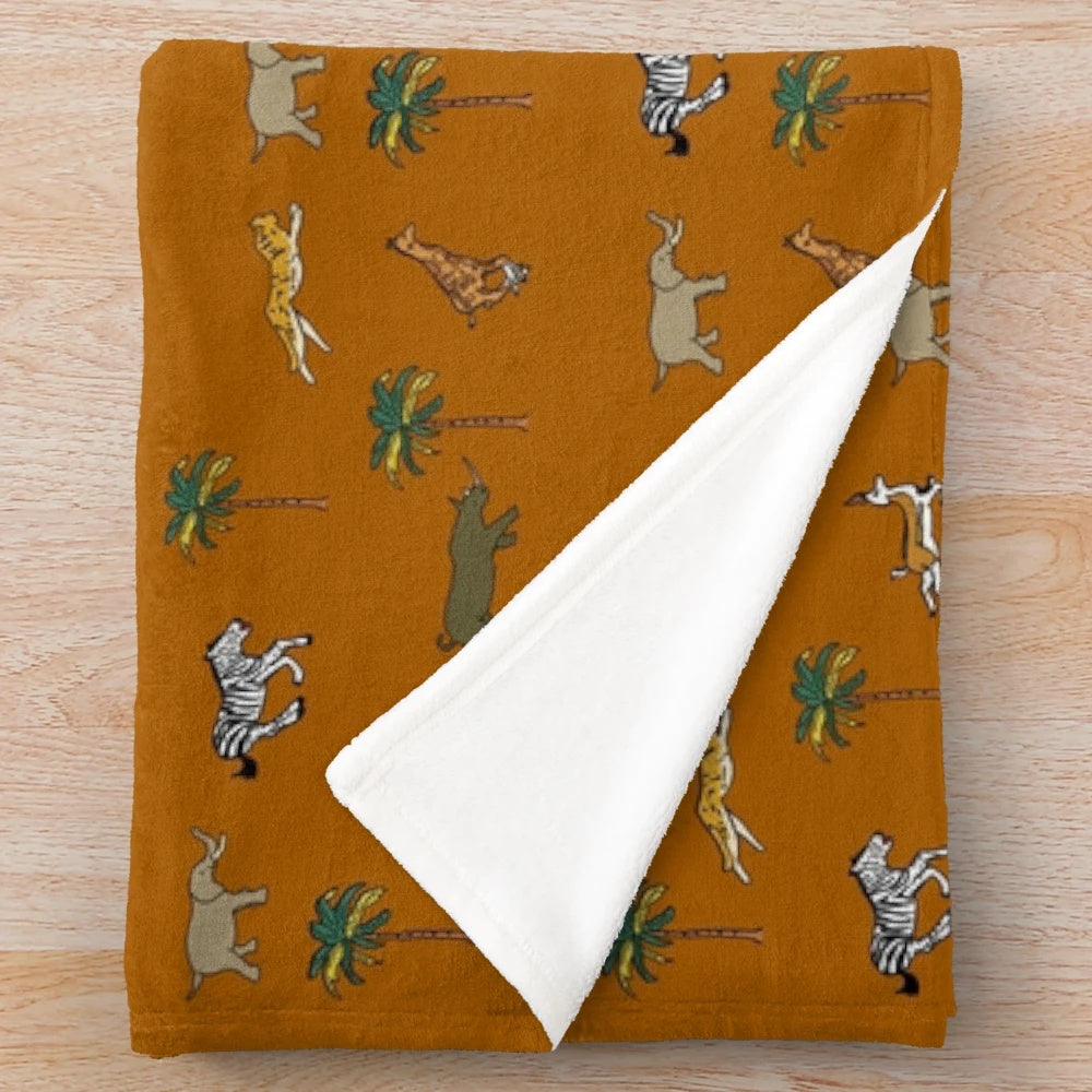 Darjeeling Limited themed plush blanket with safari animal and luggage pattern