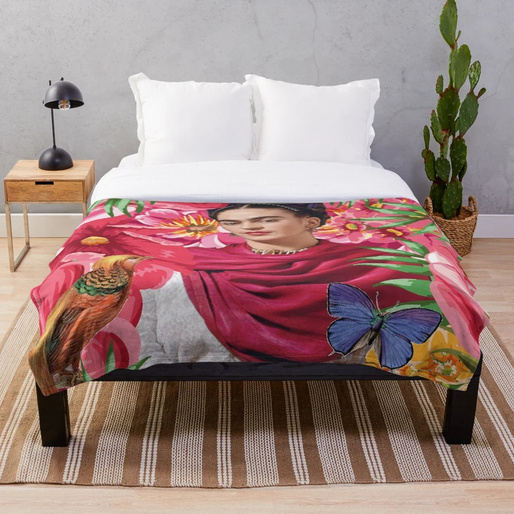 Frida Kahlo-inspired plush blanket featuring flowers, butterflies, and the iconic blue house