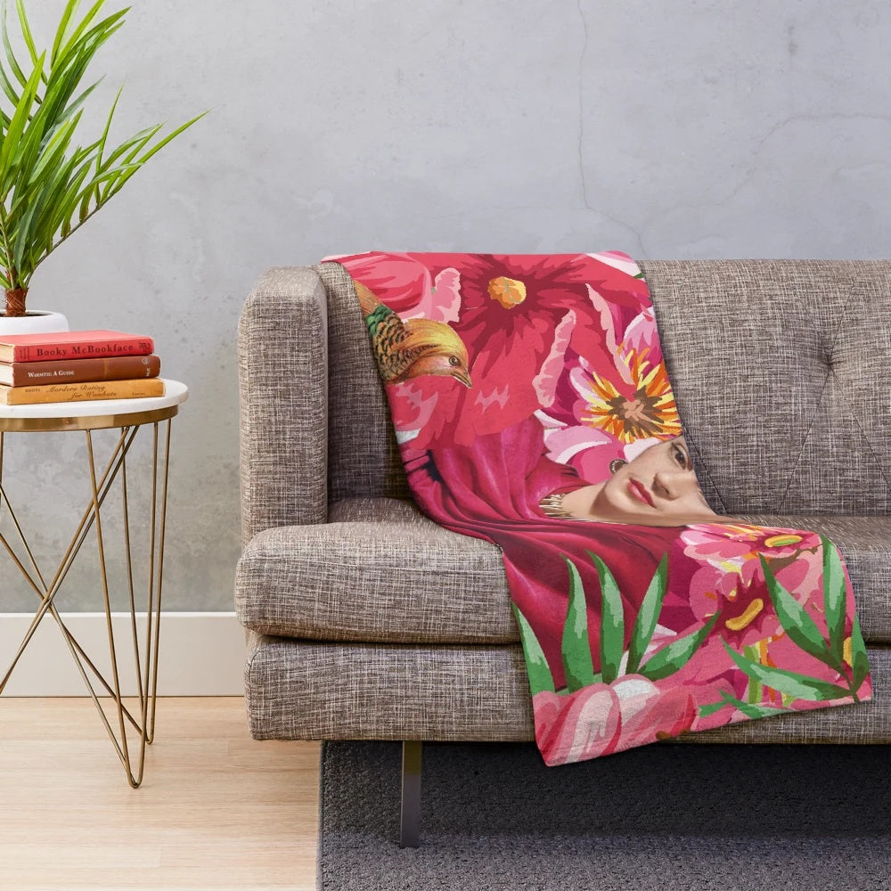 Frida Kahlo-inspired plush blanket featuring flowers, butterflies, and the iconic blue house