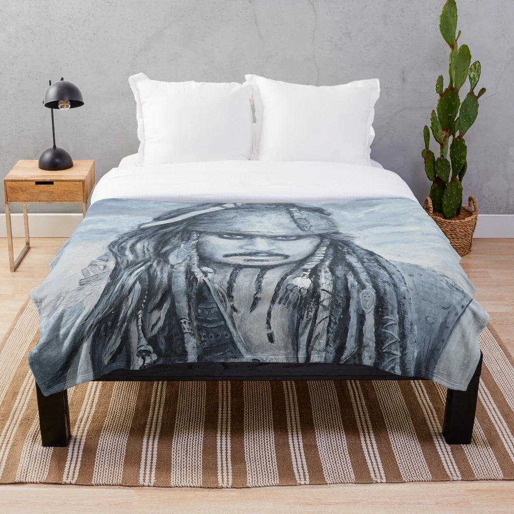 Plush blanket featuring Johnny Depp as the character Jack Sparrow from the Pirates of the Caribbean movie franchise