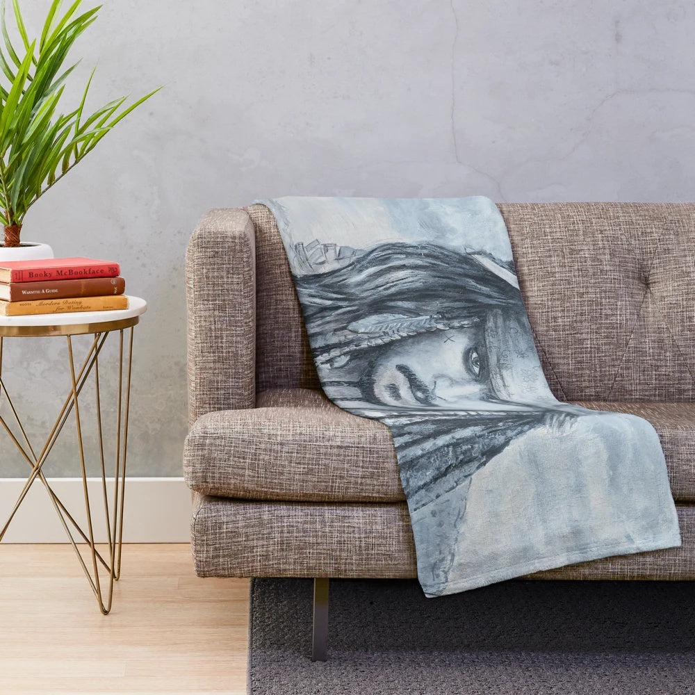 Plush blanket featuring Johnny Depp as the character Jack Sparrow from the Pirates of the Caribbean movie franchise