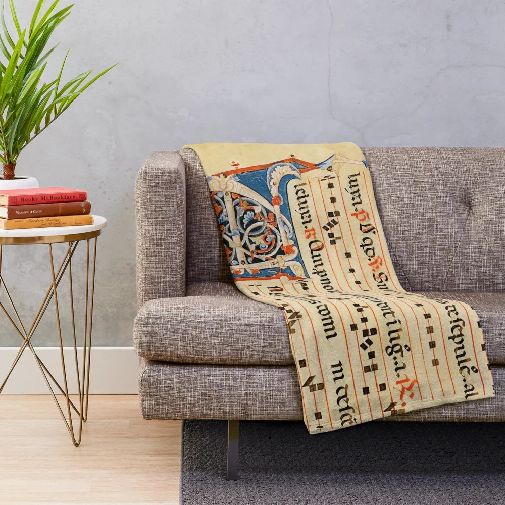 Plush blanket featuring intricate medieval musical manuscript design