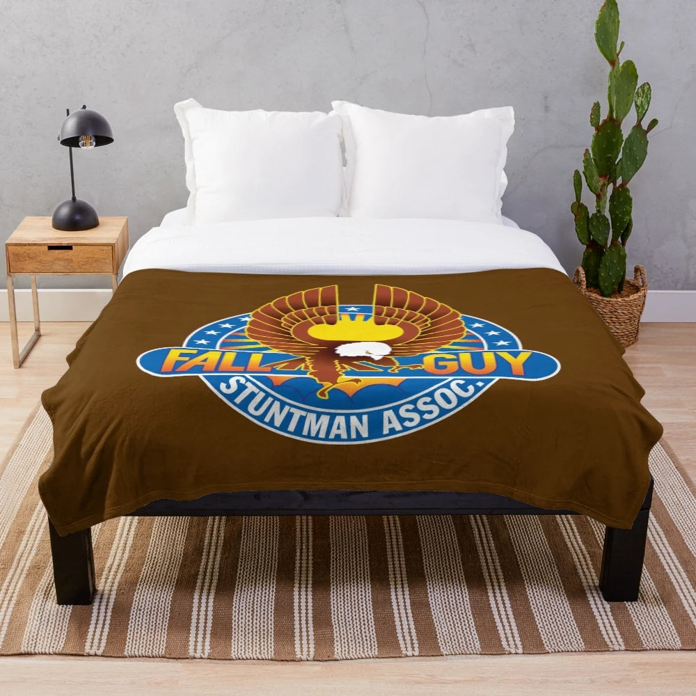 The Fall Guy plush blanket featuring stuntman Colt Seavers and his trusty 4x4 truck