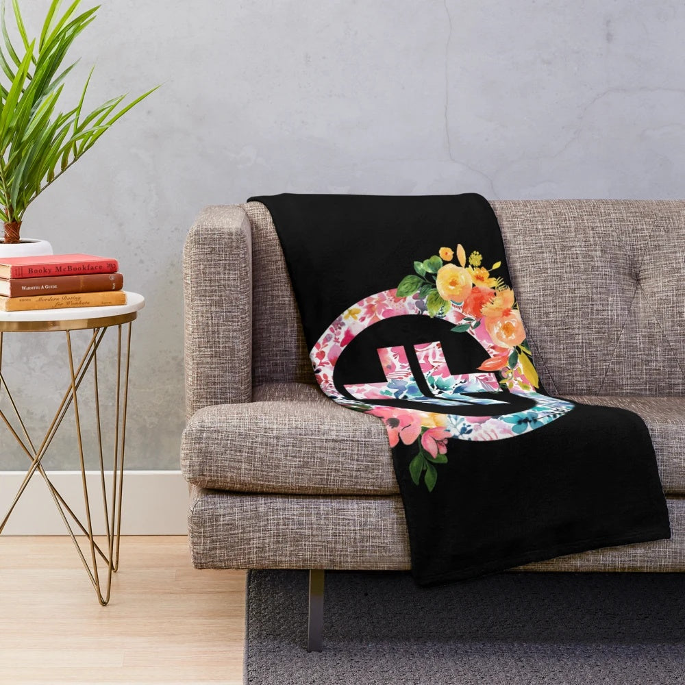 Plush blanket featuring the Take That logo