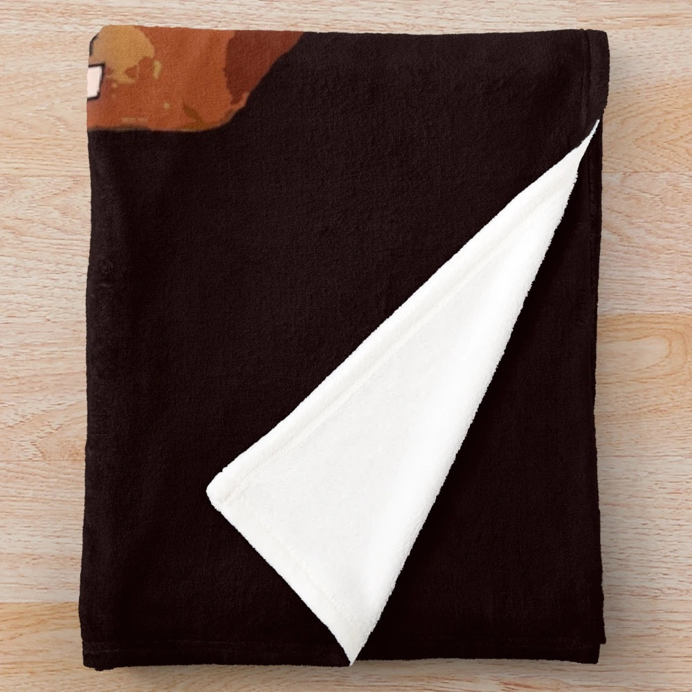 Plush blanket with "More Cowbell" design inspired by the popular SNL sketch