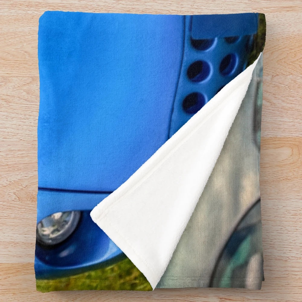 Plush blanket featuring the design of a TVR Tuscan British sports car