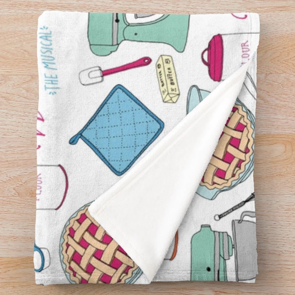 Plush blanket with cherry pie, mixing bowl, and baking ingredients design inspired by Waitress the Musical
