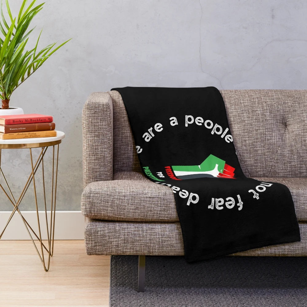 Plush blanket featuring the Palestinian flag, promoting peace and awareness