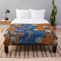 Plush blanket with aboriginal-inspired nature-themed design