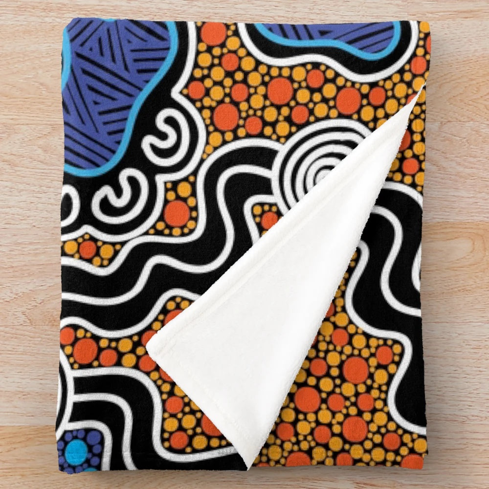 Plush blanket with aboriginal-inspired nature-themed design