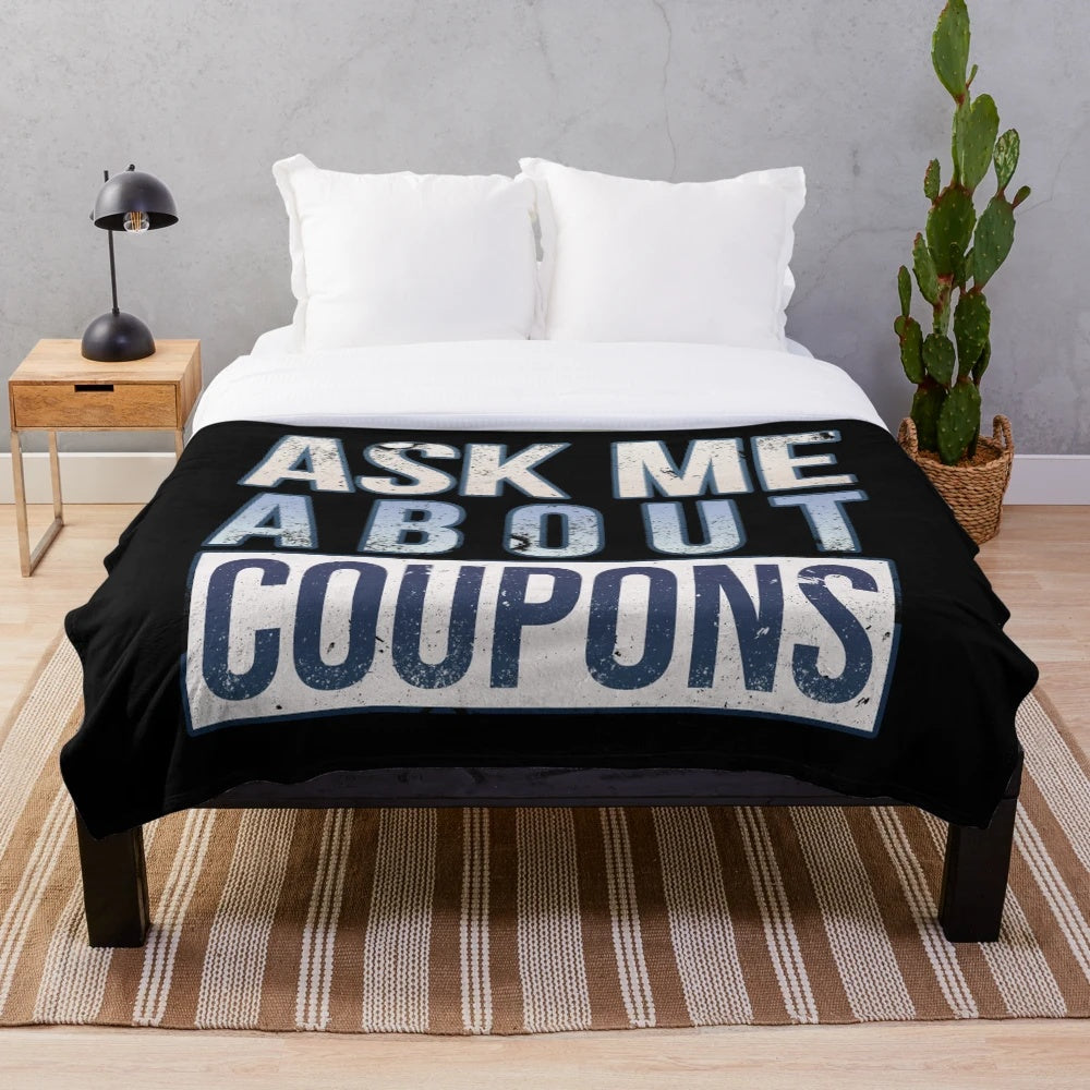 Plush blanket with "Ask Me About Coupons" design