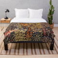 Plush blanket featuring autumn forest animals and floral tapestry design