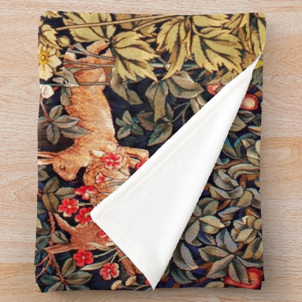 Plush blanket featuring autumn forest animals and floral tapestry design