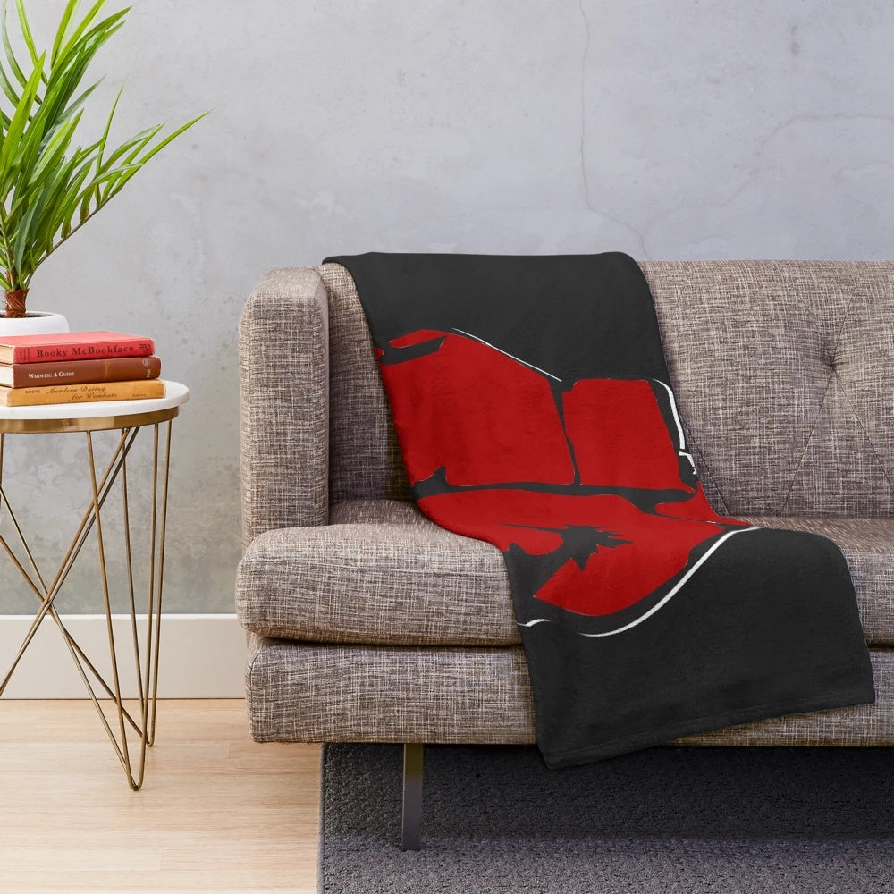 Plush blanket with red boxing gloves design