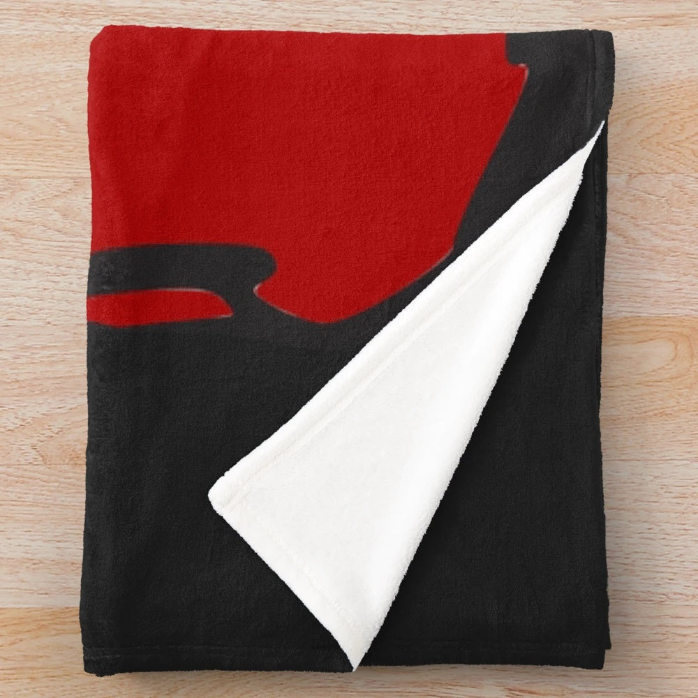 Plush blanket with red boxing gloves design