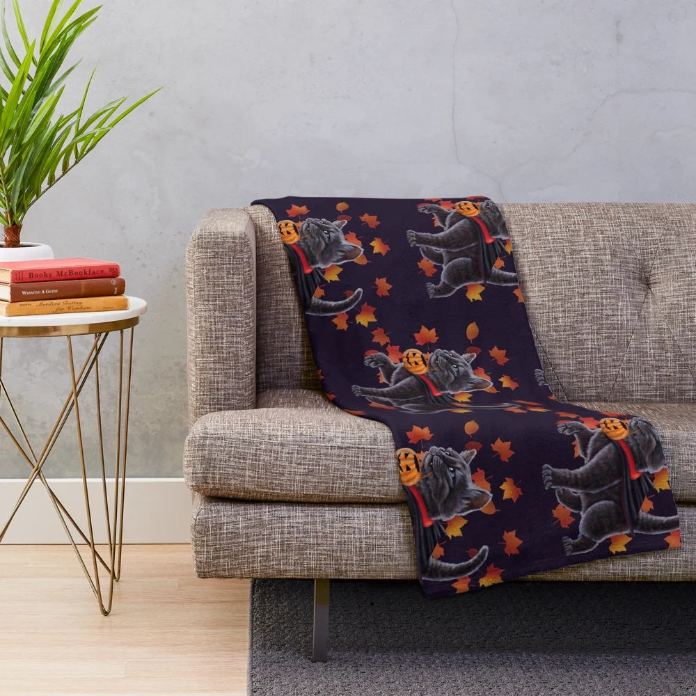 Cozy plush blanket featuring a cute Halloween-themed kitten in a vampire costume
