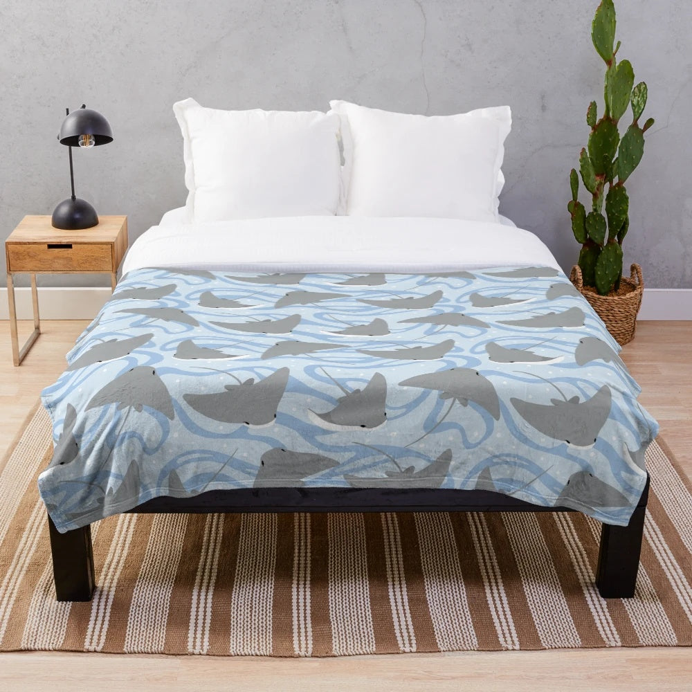 Plush blanket featuring cownose rays and stingrays, perfect for ocean and marine life enthusiasts