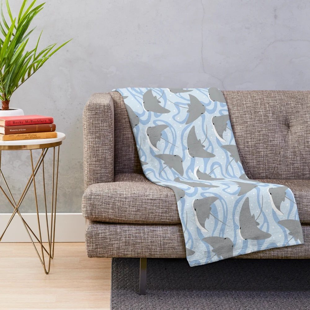 Plush blanket featuring cownose rays and stingrays, perfect for ocean and marine life enthusiasts